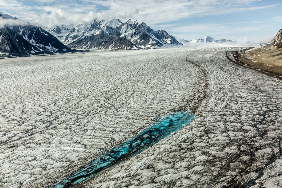 Turquoise meltwater stands out against the surface of the Kaskawulsh glacier--Kaskawulsh glacier in Yukon's Kulane National Park-1277